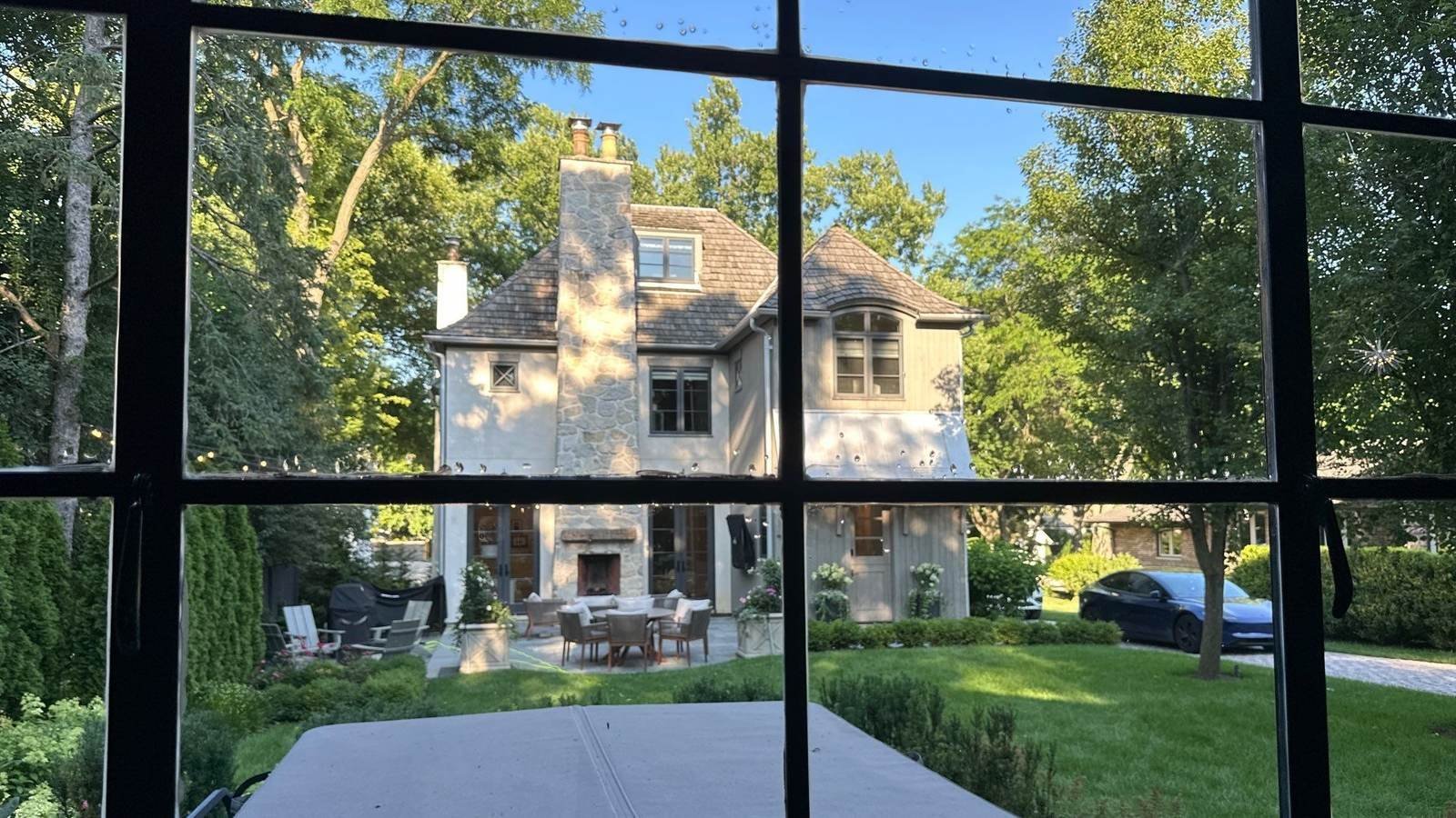 View through a freshly cleaned window wall onto the grounds of a Barrington, IL estate