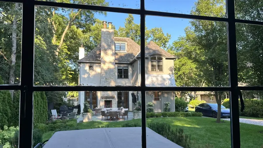 View through a freshly cleaned window wall onto the grounds of a Barrington, IL estate