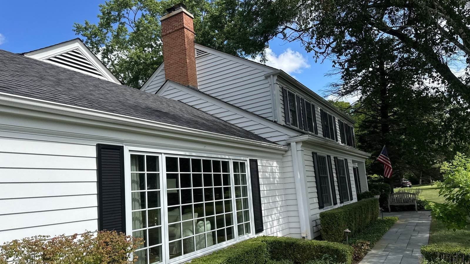 Home with a large sunroom window wall after a Pane Pal exterior window cleaning