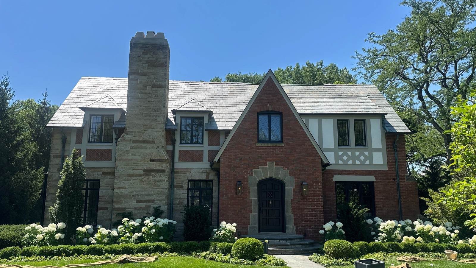 Historic brick Tudor home with a slate roof in Lake Forest, IL serviced by Pane Pal