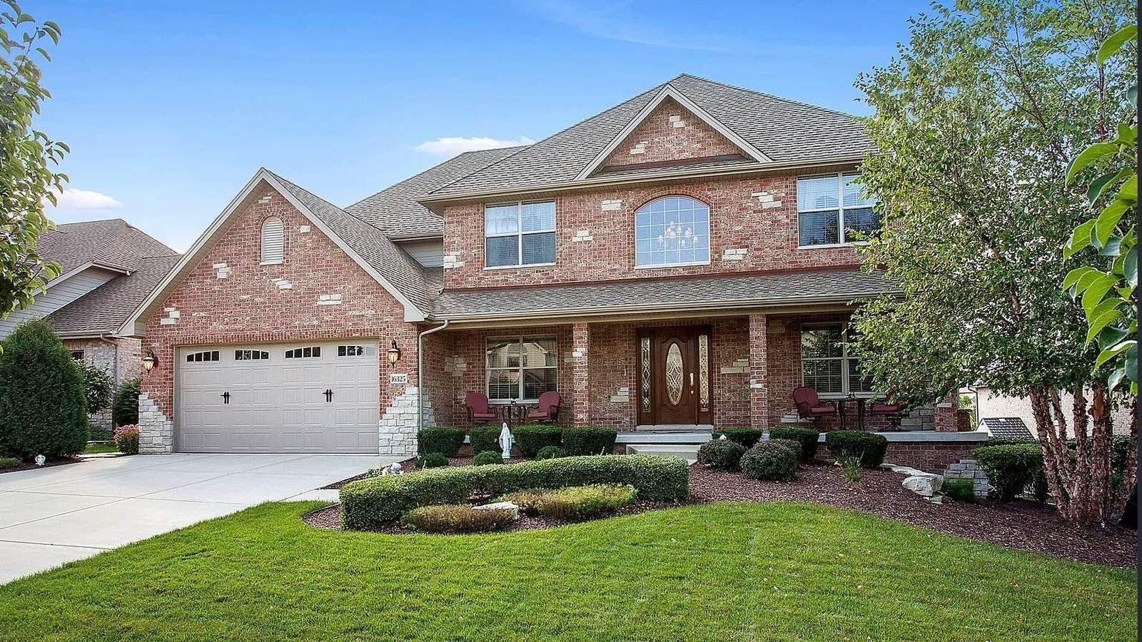 Brick two-story home after exterior window cleaning by Pane Pal