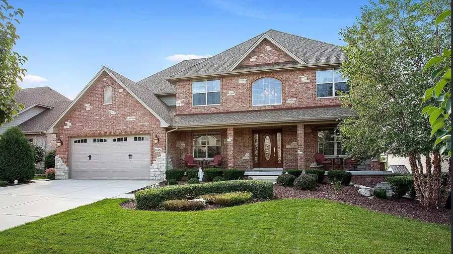 Brick two-story home after exterior window cleaning by Pane Pal